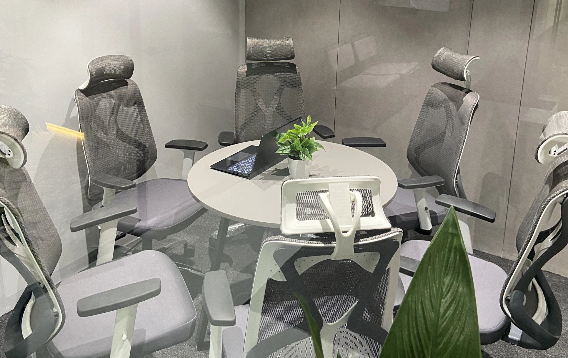 Contemporary meeting space with wooden tables and collaborative setup